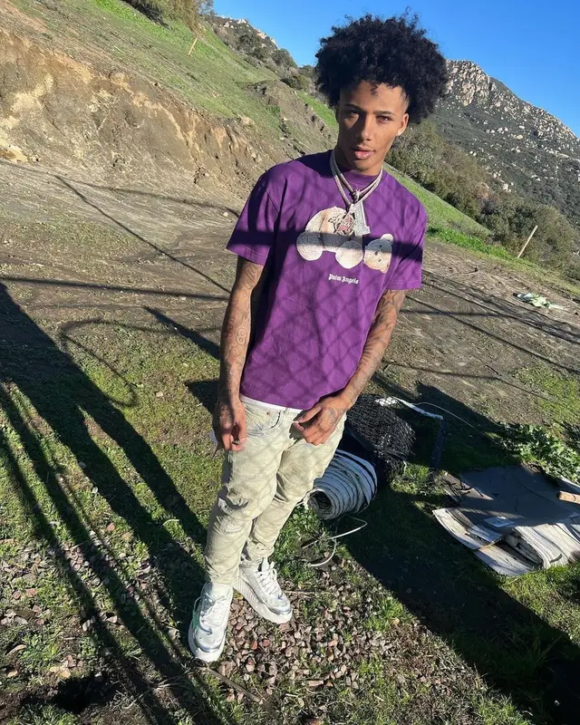 Mikey outfit in Palm Angels, Purple Brand, and Louis Vuitton, 2023
