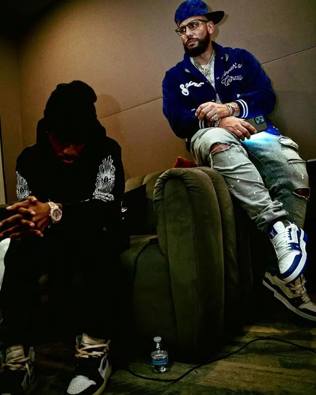 DJ Drama outfit in Saint Michael, Tom Ford, and Louis Vuitton, 2023