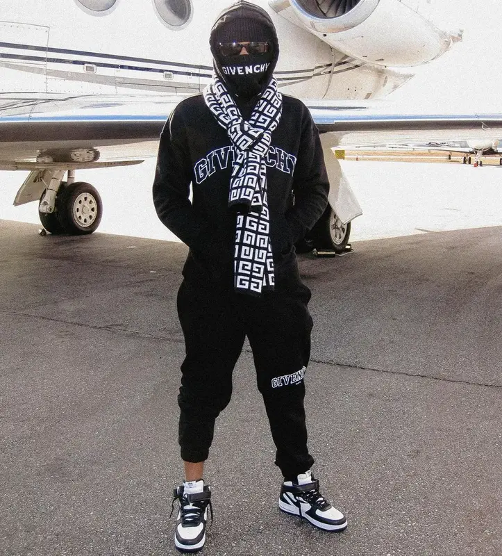 Lil Baby outfit in Nike, Givenchy, and Stussy, 2023