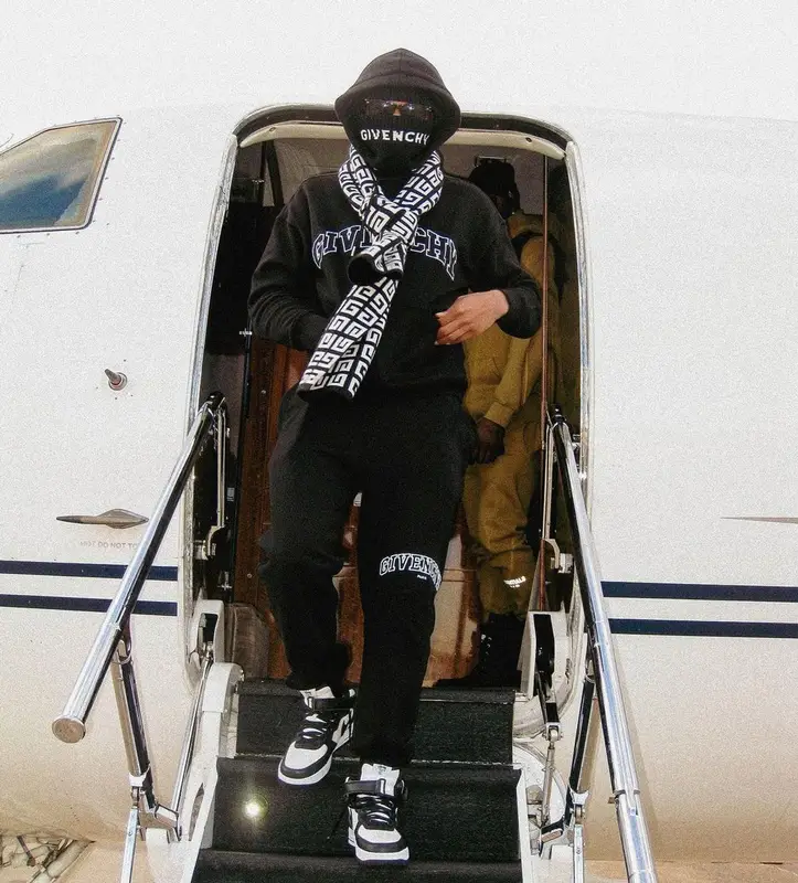 Lil Baby outfit in Nike, Givenchy, and Stussy, 2023