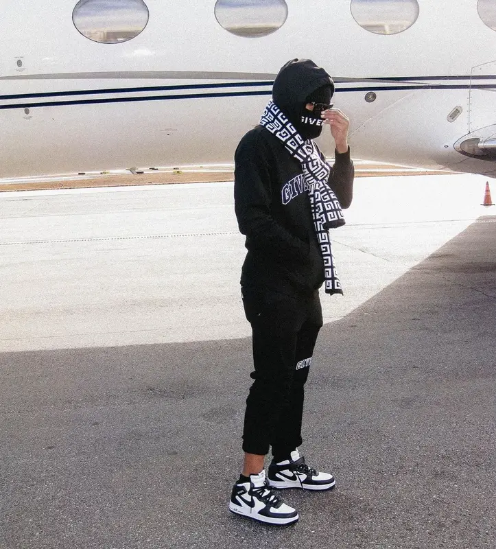 Lil Baby outfit in Nike, Givenchy, and Stussy, 2023