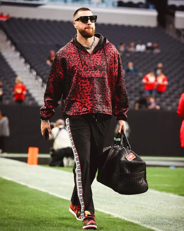 Travis Kelce outfit in Just Don, Bottega Veneta, and Louis Vuitton, 2023