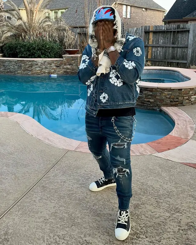 Peezy outfit in Levi’s, Amiri, and Denim Tears, 2023