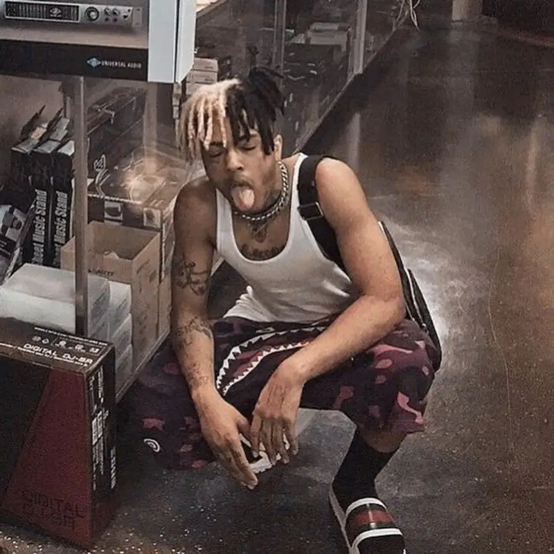 XXXTentacion outfit in Hanes, Bape, and Louis Vuitton, 2021