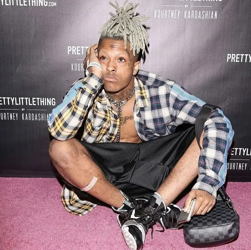 XXXTentacion outfit in Louis Vuitton, XXXTentacion Merch, and Nike, 2019