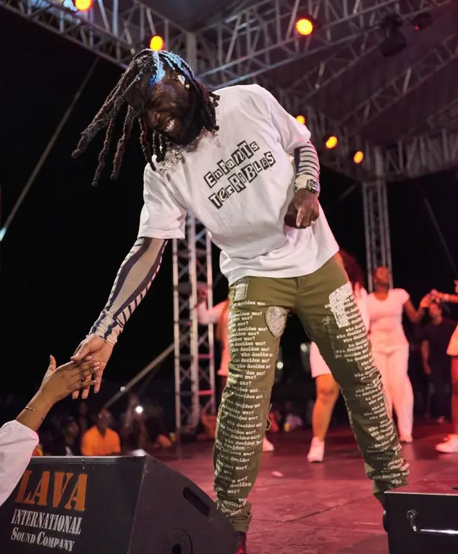 Burna Boy outfit in Sacai, Jean Paul Gaultier, and Who Decides War, 2023