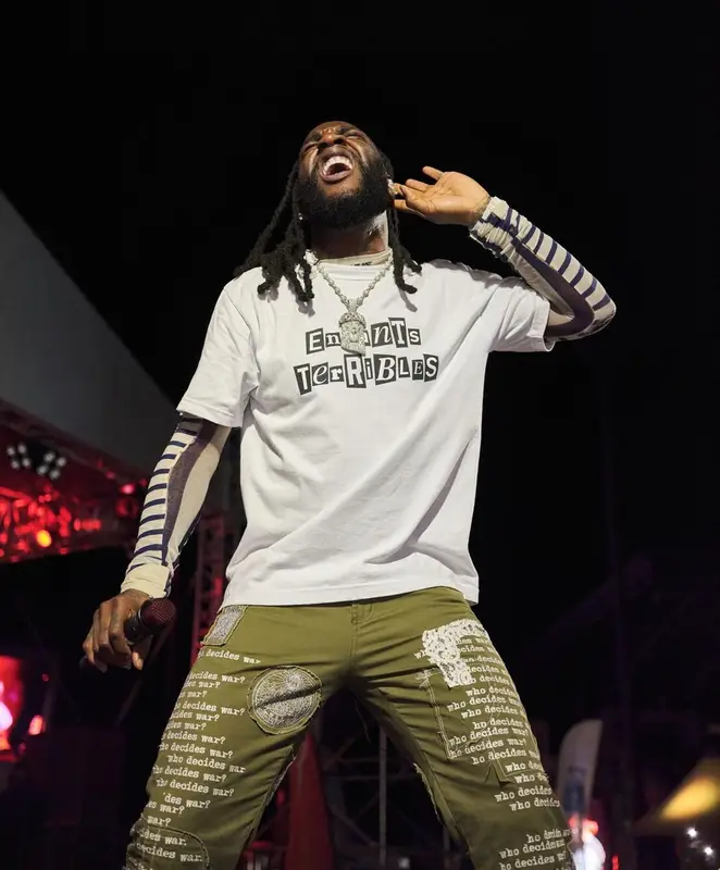 Burna Boy outfit in Sacai, Jean Paul Gaultier, and Who Decides War, 2023