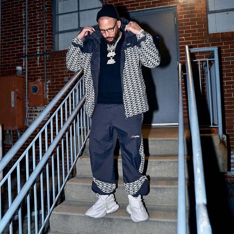 DJ Drama outfit in Louis Vuitton, Balmain, and Tom Ford, 2023