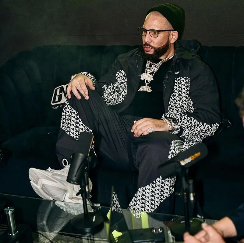 DJ Drama outfit in Louis Vuitton, Balmain, and Tom Ford, 2023