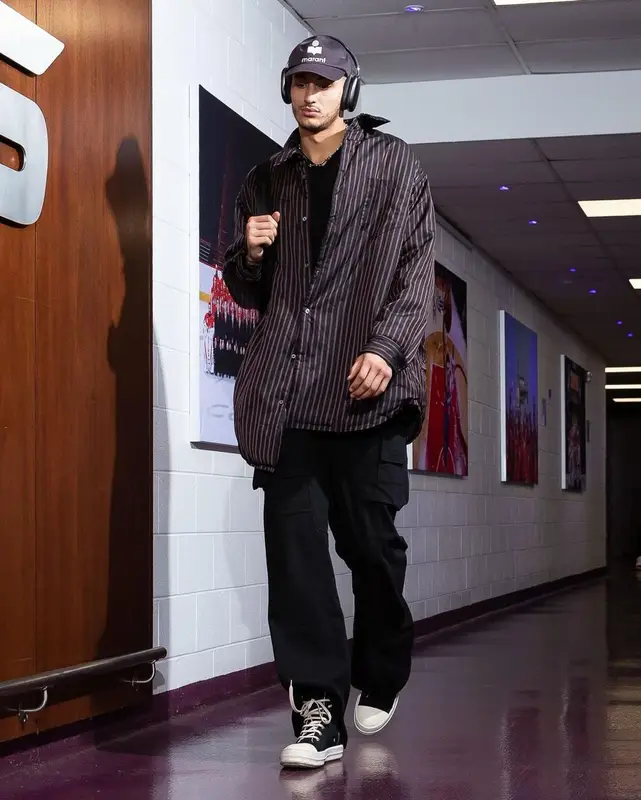 Kyle Kuzma outfit in Maison Margiela, Isabel Marant, and Apple, 2023
