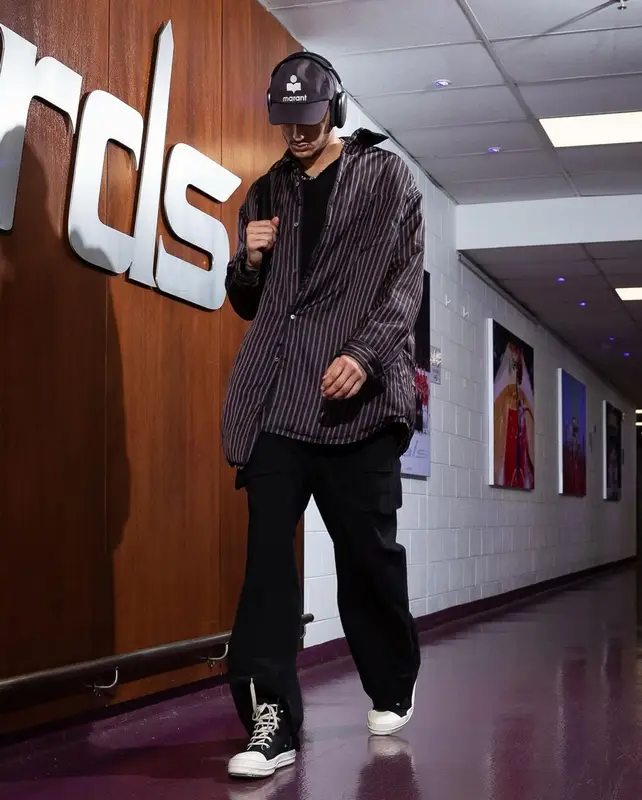 Kyle Kuzma outfit in Maison Margiela, Isabel Marant, and Apple, 2023