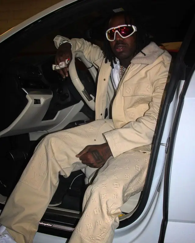 EST Gee outfit in Louis Vuitton, Nike, and Moncler, 2023
