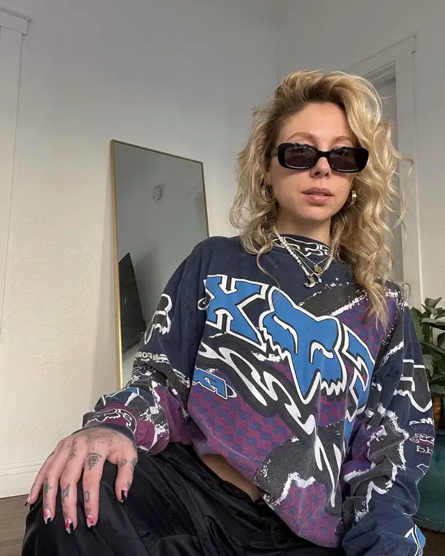 Lil Debbie outfit in Fox Racing, Jordan, and Fendi, 2023