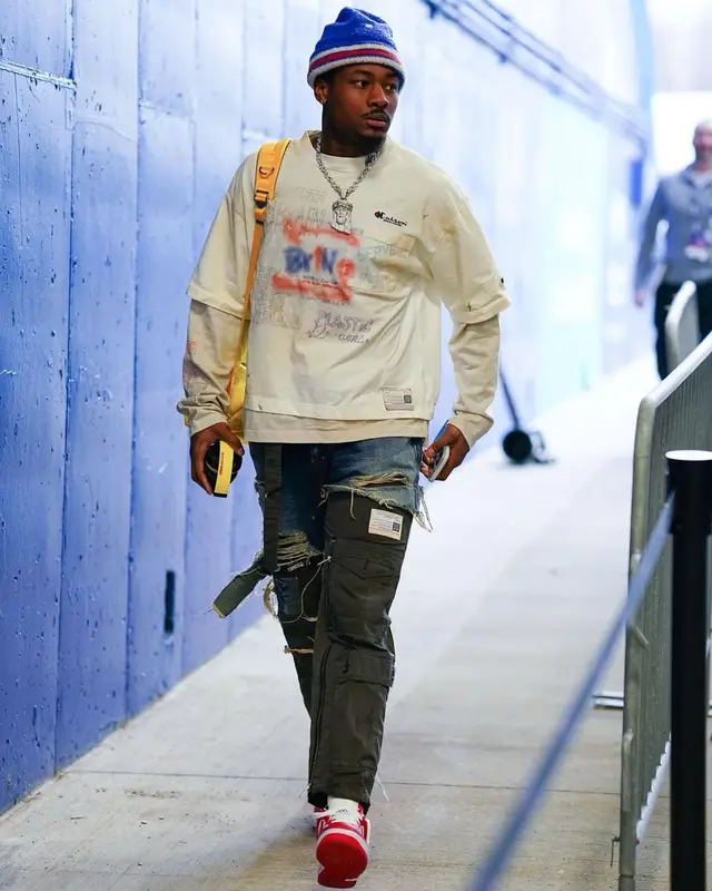 Stefon Diggs outfit in Louis Vuitton, Undercover, and Acne Studios, 2023