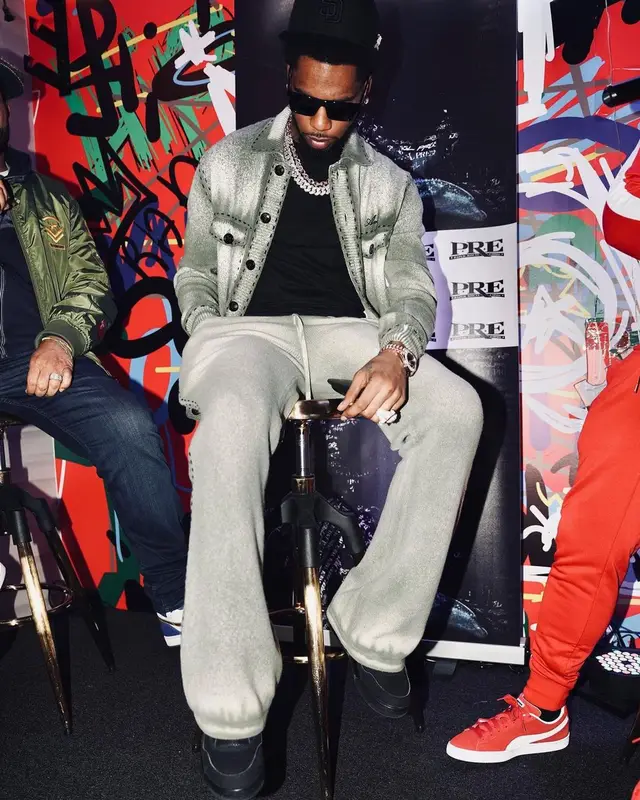 Key Glock outfit in Amiri, Jordan, and Prada, 2022
