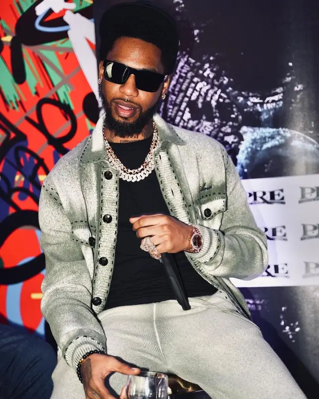 Key Glock outfit in Amiri, Jordan, and Prada, 2022