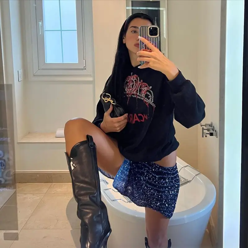 Dua Lipa outfit in JW Anderson, Dior, and Miu Miu, 2022