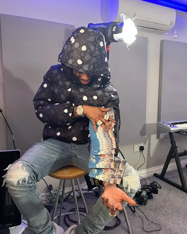 Russ Millions outfit in Louis Vuitton, Amiri, and Yayoi Kusama, 2023