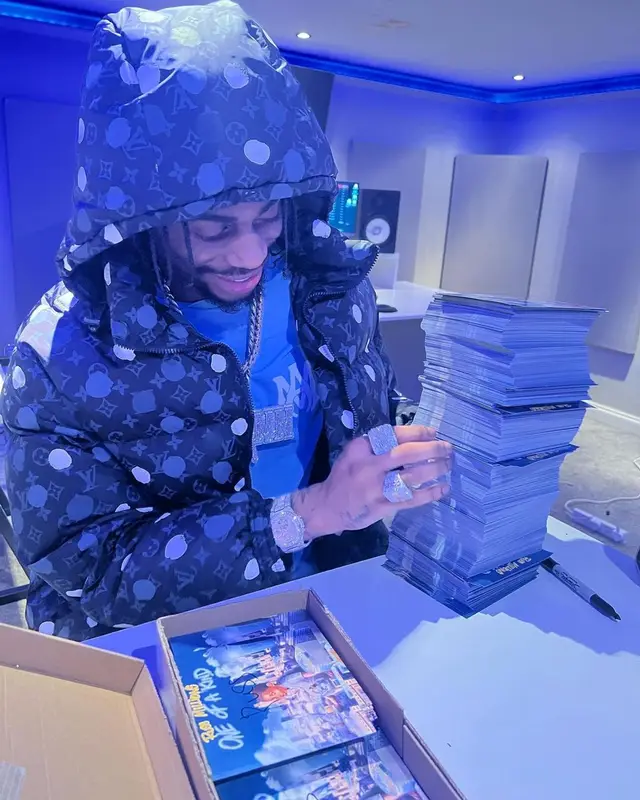 Russ Millions outfit in Louis Vuitton, Amiri, and Yayoi Kusama, 2023