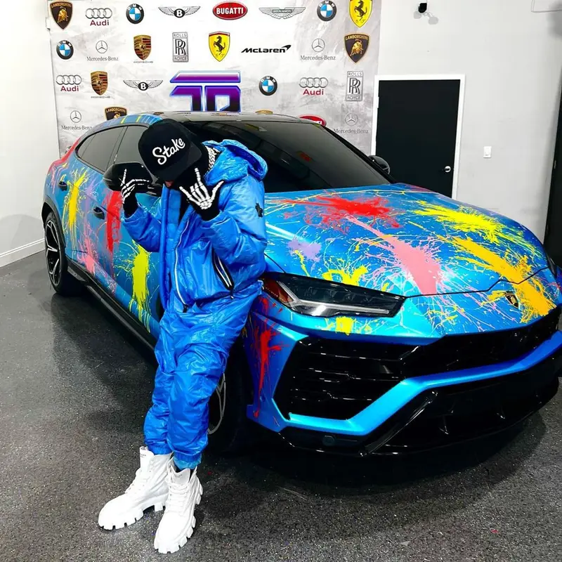 6ix9ine outfit in Moncler, Prada, and Louis Vuitton, 2023