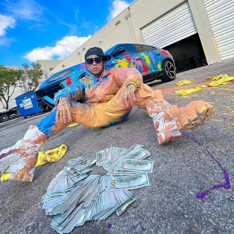 6ix9ine outfit in Moncler, Prada, and Louis Vuitton, 2023