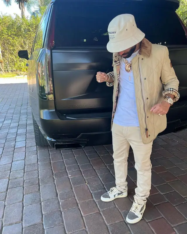 Arcangel outfit in Purple Brand, Nike, and Burberry, 2023