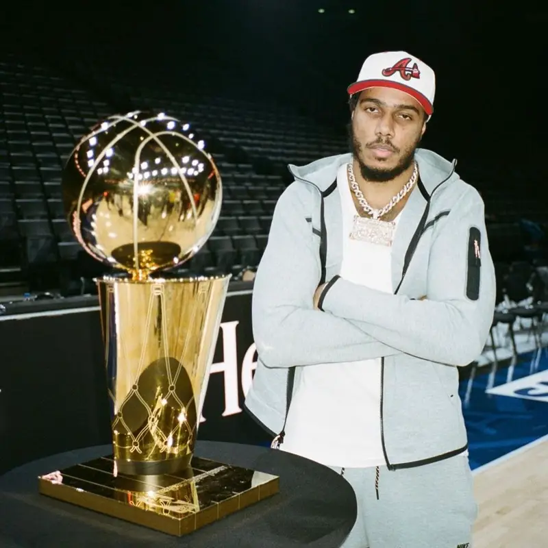 AJ Tracey outfit in Nike, Undefeated, and New Era, 2023