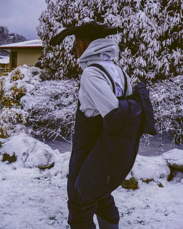 Lil Murden outfit in The North Face, Supreme, and Coach, 2023