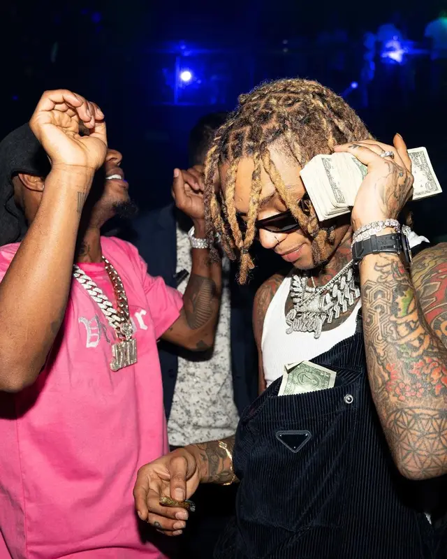 Slim Jxmmi outfit in Verborgen, Bape, and Fiji Water, 2023