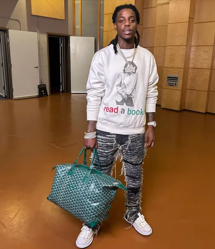 OMB Peezy outfit in Denim Tears, 1017 Alyx 9SM, and Saint Michael, 2023