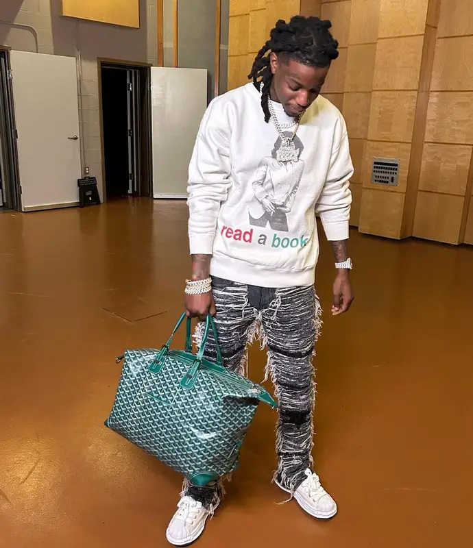OMB Peezy outfit in Denim Tears, 1017 Alyx 9SM, and Saint Michael, 2023
