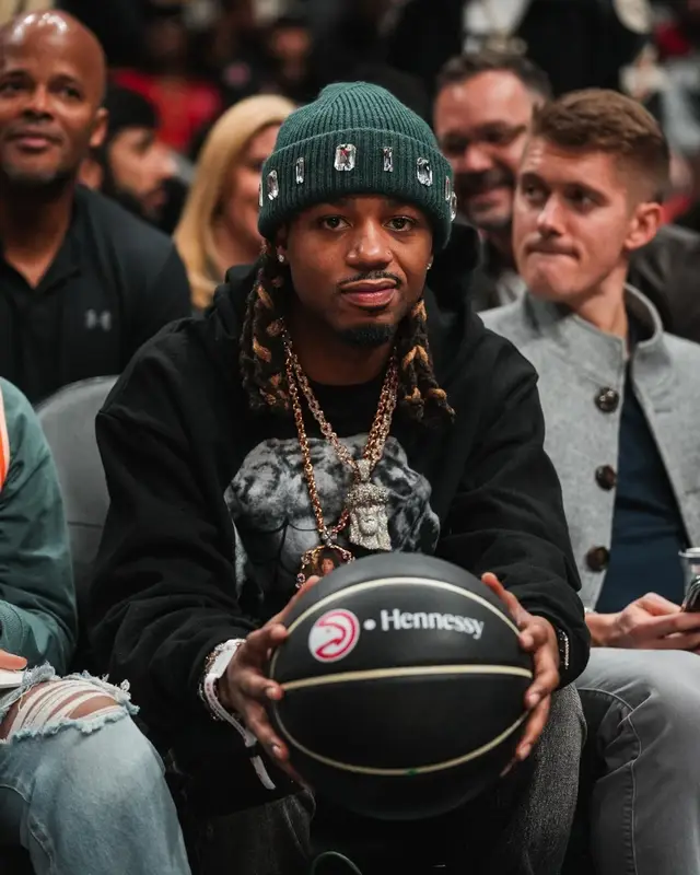 Metro Boomin outfit in Cosey X Cosey, Atlanta Hawks, and Hennessy, 2023