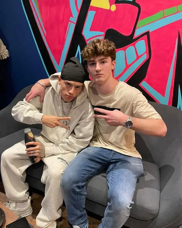 Central Cee outfit in Fear of God, Louis Vuitton, and Apple, 2022