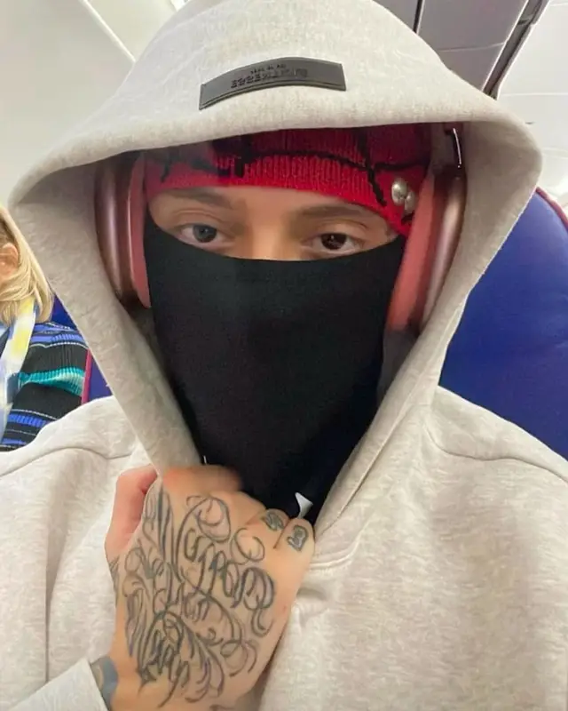 Central Cee outfit in Fear of God, Louis Vuitton, and Apple, 2022