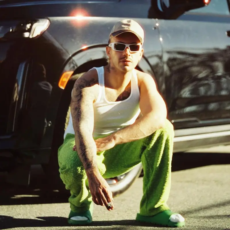 Feid outfit in Eric Emanuel, Oakley, and Louis Vuitton, 2023