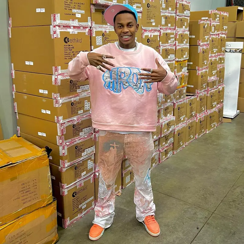 Cocash outfit in Who Decides War, Jordan, and DJ Khaled Merch, 2022