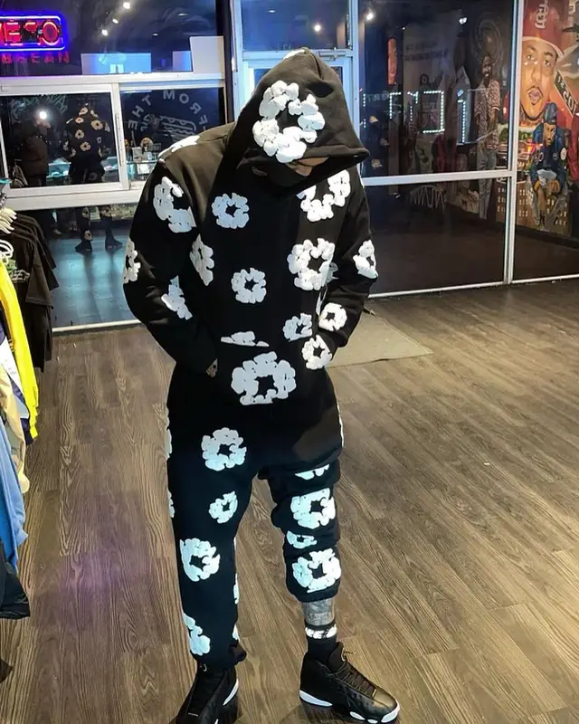 Dave East outfit in Denim Tears, Jordan, and Nike, 2023