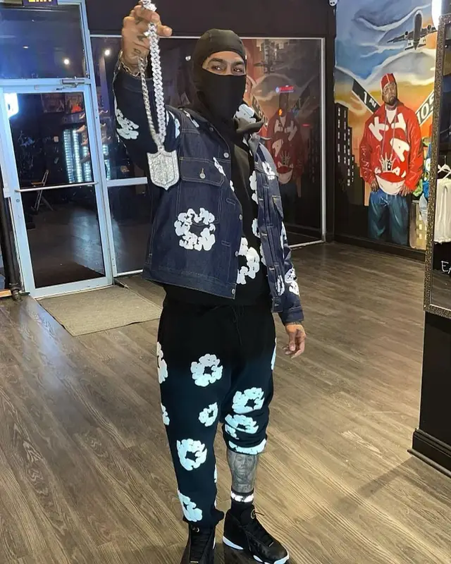 Dave East outfit in Denim Tears, Jordan, and Nike, 2023