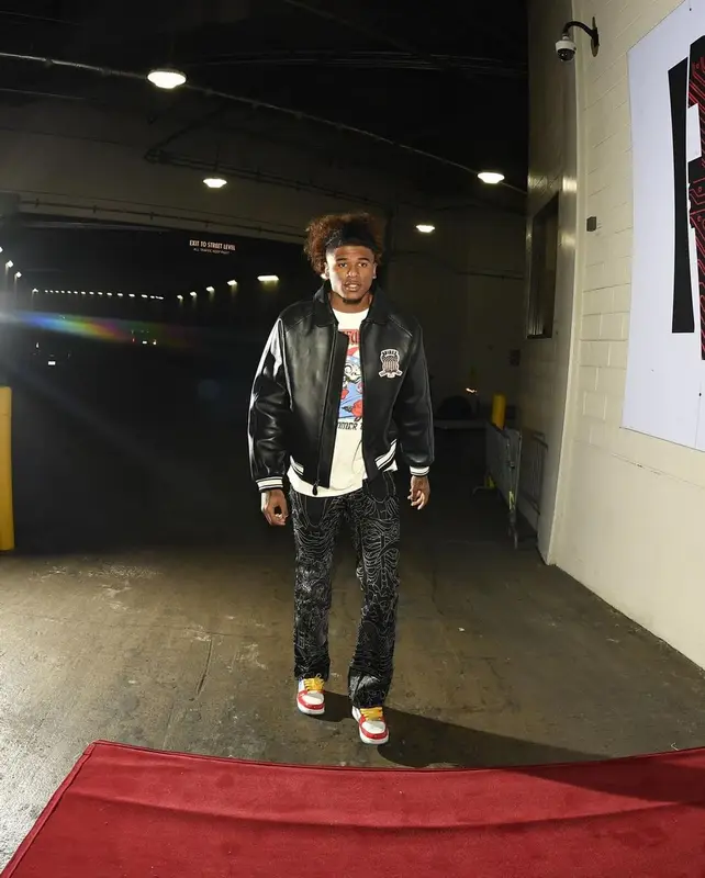 Jalen Green outfit in Avirex, Who Decides War, and Bape, 2023