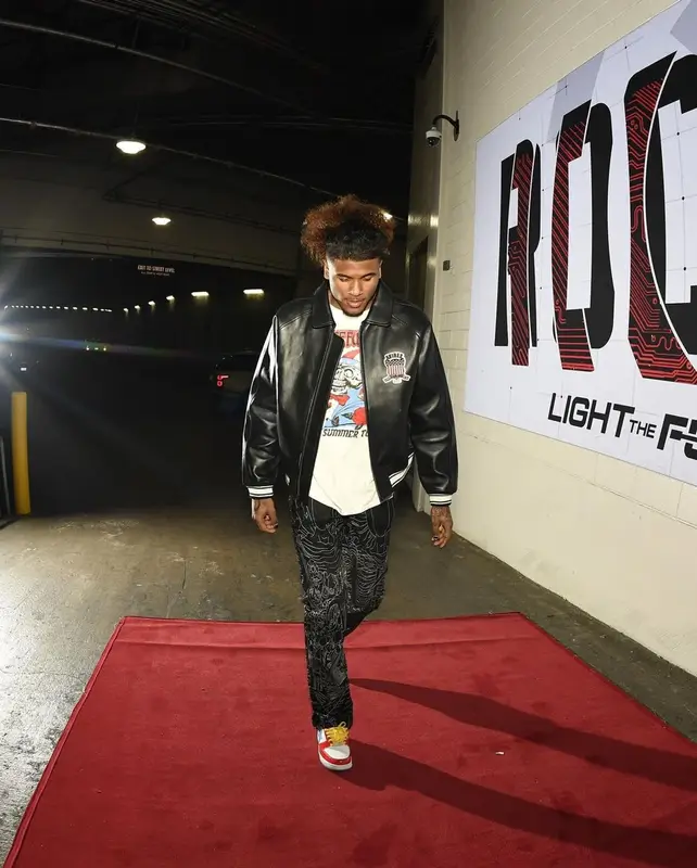 Jalen Green outfit in Avirex, Who Decides War, and Bape, 2023