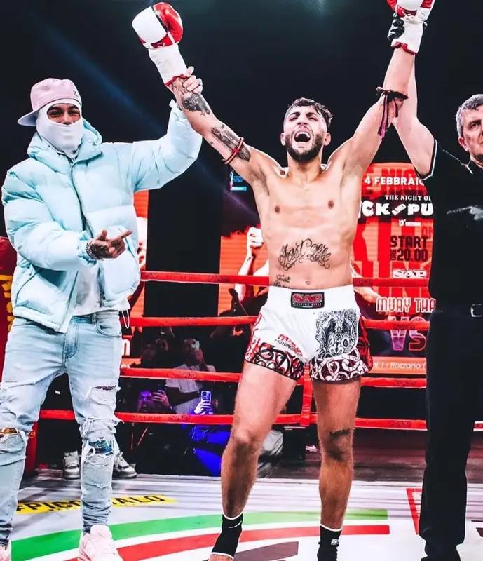 Sfera Ebbasta outfit in Amiri, Louis Vuitton, and Supreme, 2023