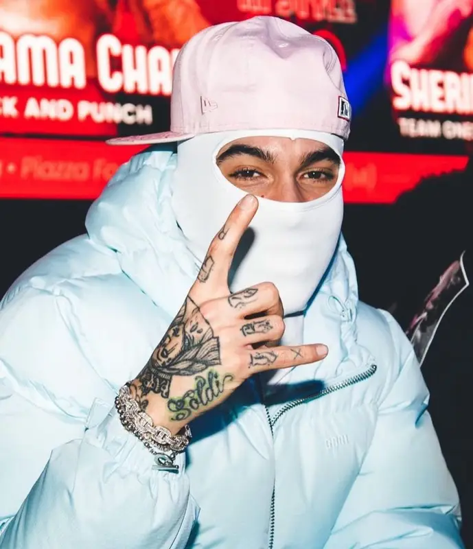 Sfera Ebbasta outfit in Amiri, Louis Vuitton, and Supreme, 2023