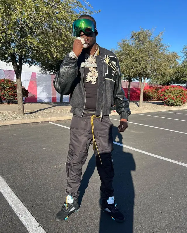 Bobby Shmurda outfit in Rhude, Prada, and Oakley, 2023