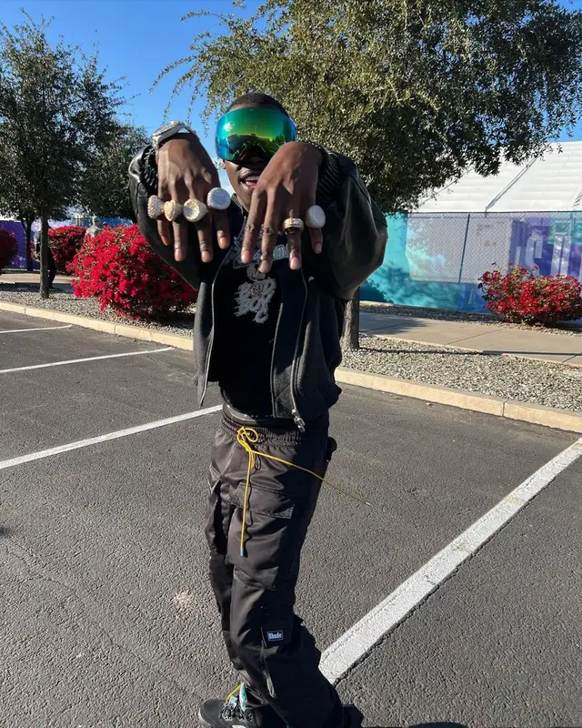 Bobby Shmurda outfit in Rhude, Prada, and Oakley, 2023