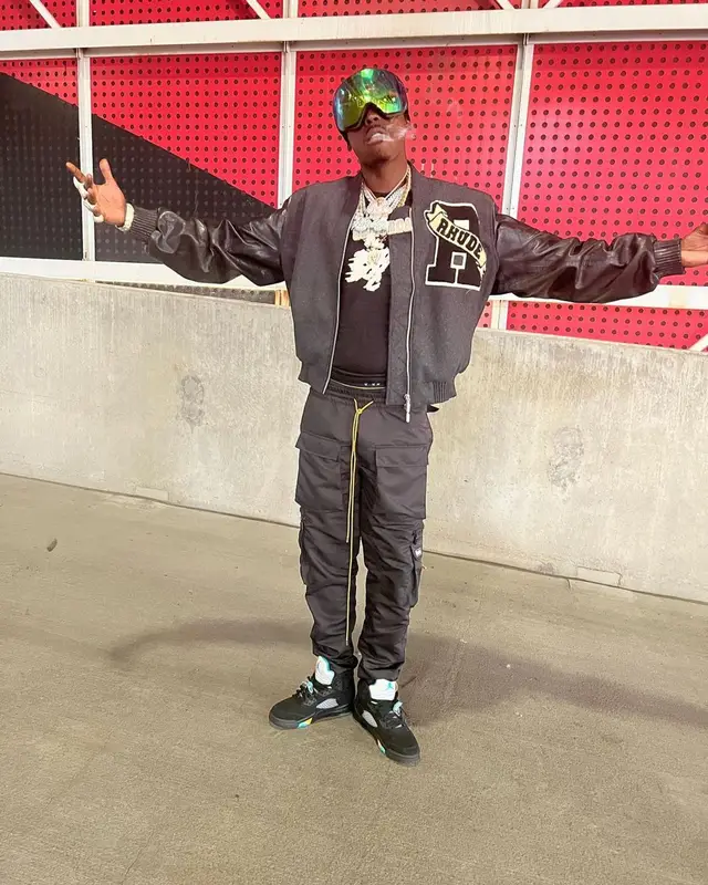 Bobby Shmurda outfit in Rhude, Prada, and Oakley, 2023