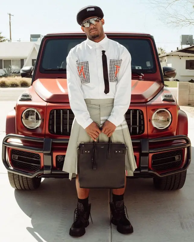 JuJu outfit in Thom Browne, Oakley, and Kenzo, 2023