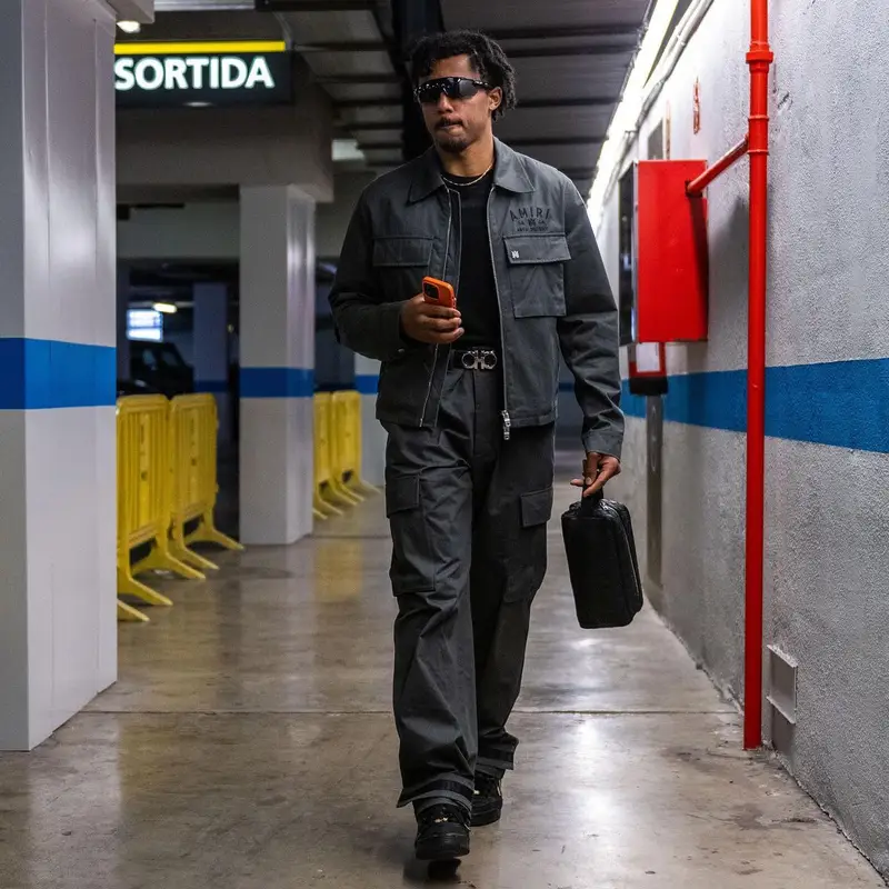 Jules Kounde outfit in Amiri, Ferragamo, and Oakley, 2023