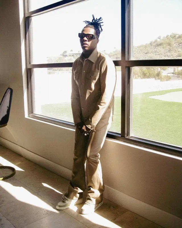 Lil Baby outfit in Cout De La Liberte, Louis Vuitton, and Prada, 2023