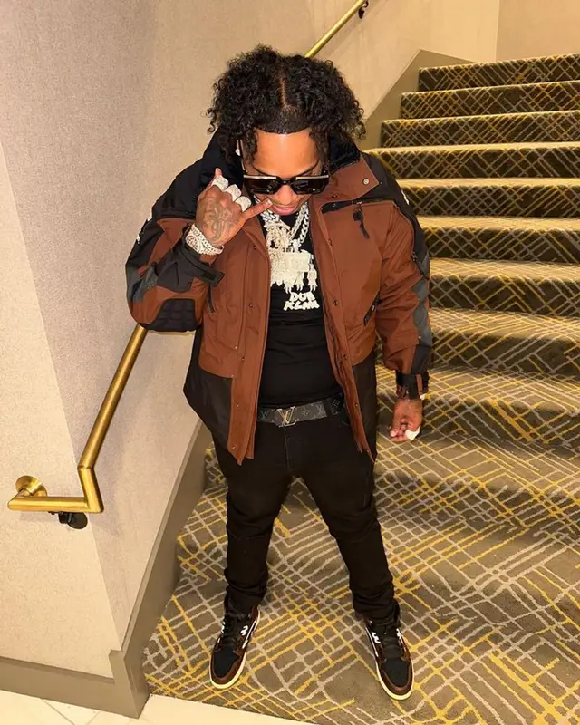 Finesse2tymes outfit in Supreme, Louis Vuitton, and The North Face, 2023