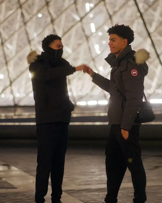 Aj Barbour outfit in Canada Goose, Stone Island, and Louis Vuitton, 2022